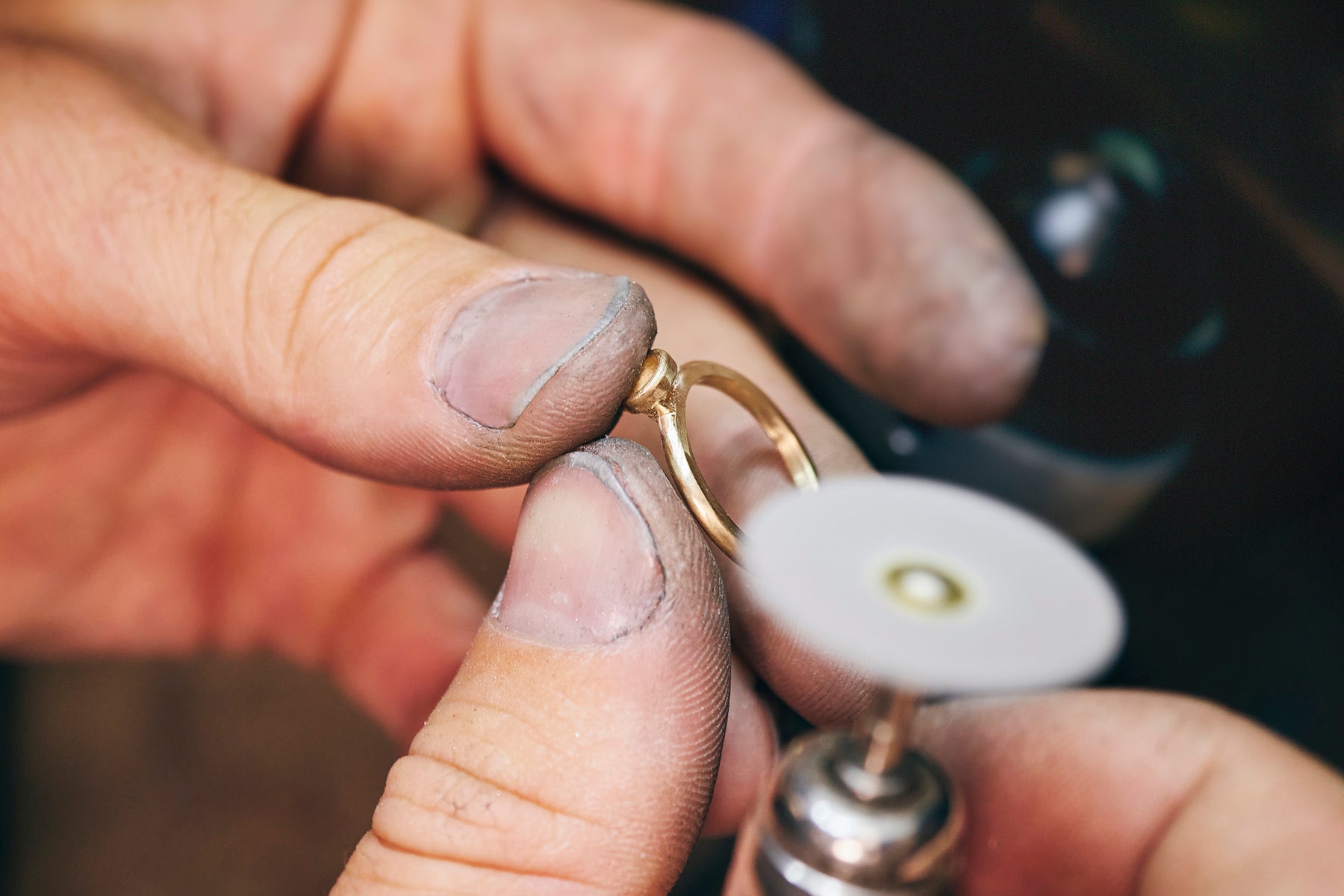 Jeweler customizing a ring