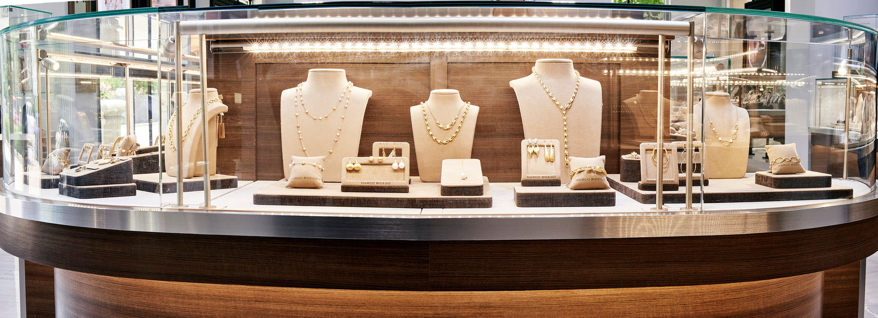 Assorted diamond rings and necklaces in a display case